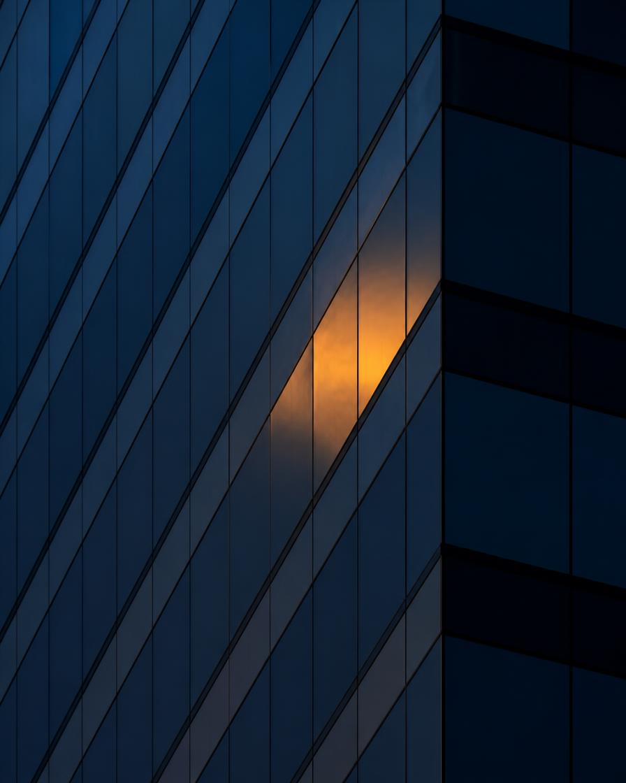 Glass and steel tower facade at dusk